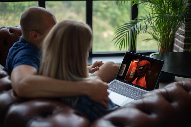 Couple enjoying Korean drama together on laptop