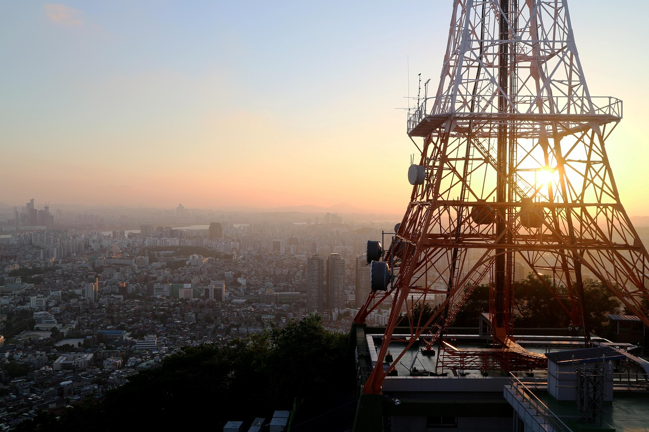 Seoul skyline at sunset showing modern skyscrapers and traditional architecture representing Korea travel trends 2026
