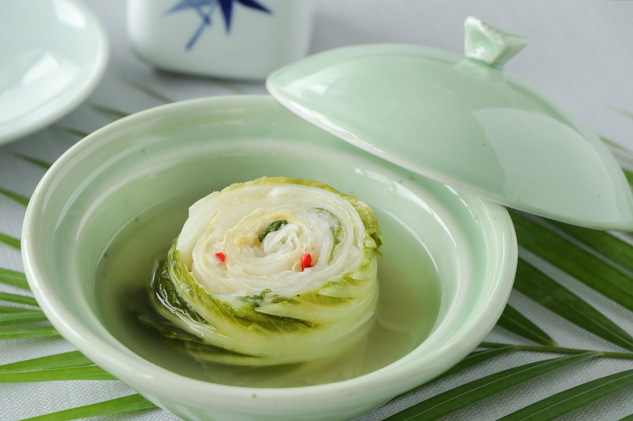 White kimchi baek kimchi in dish showcasing mild fermented Korean side dish